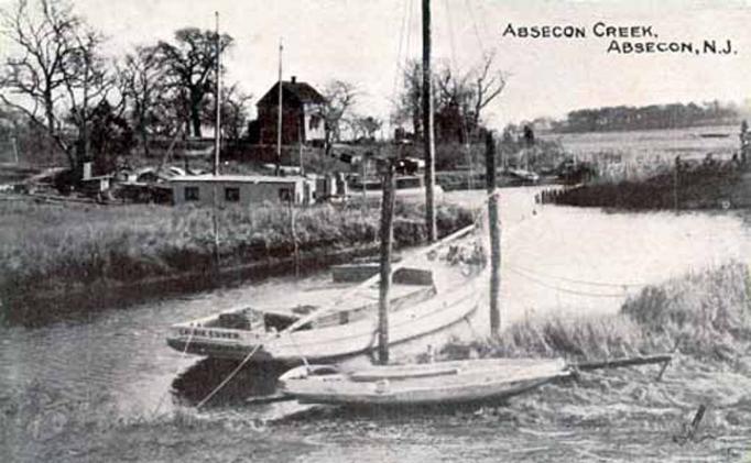 Absecon - view of Absecon Creek with boats and old house - c 1910