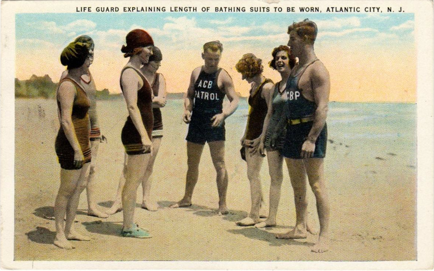 Atlantic City - Beach Patrol explains proper swimsuit leng to young women - 1923