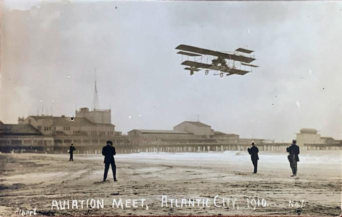 Atlantic City - Wright or Curtis biplane over the beach - c 1910