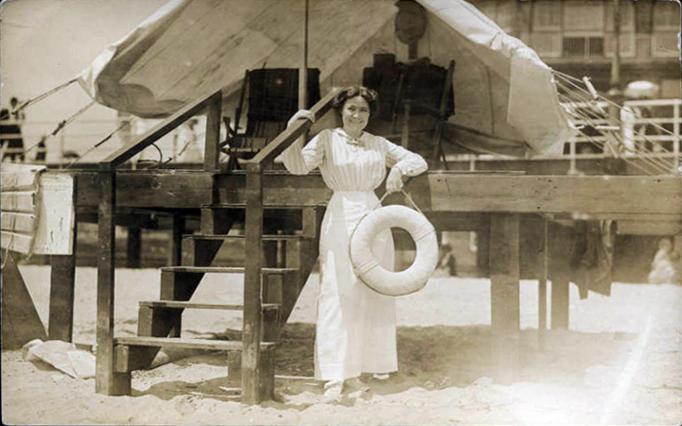 Atlantic City - Young woman with a life ring posed on the boardwalk steps - Harper B Smith