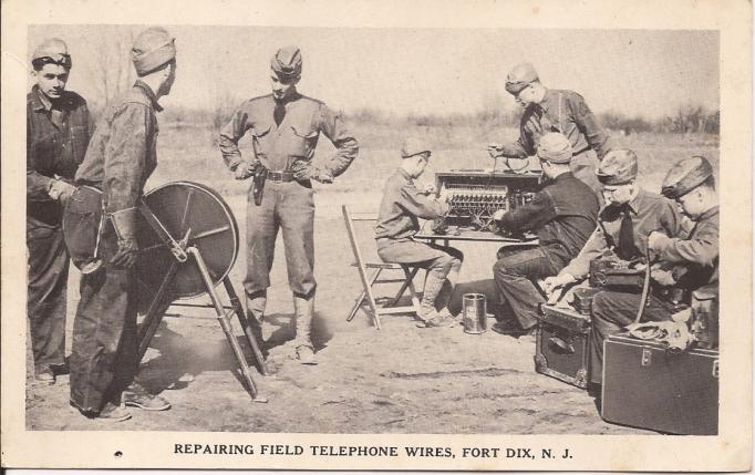 Fort Dix - Repairing field telephone wires - 1940s
