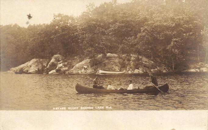 Beaver Lake - folks in canoes with rocky lakeshore