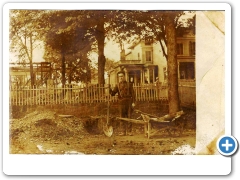 Clinton - Man with a spade standing in front of a house - c 1910