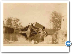 Clinton - Collapsed bridge with a car and truck on it
