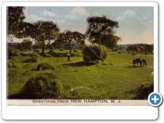 New Hampton - Greetings From New Hampton with a picture of a hay wagon at harvest - 1919