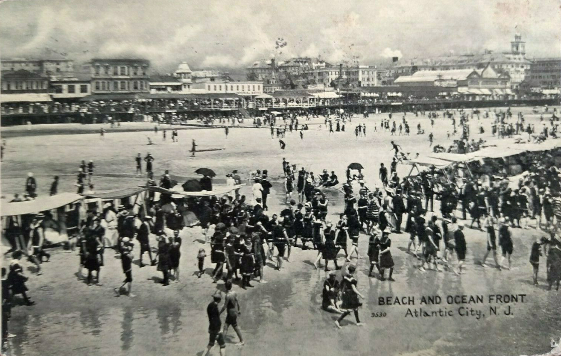 Atlantic City - An epic view of the beach bathers and boardwalk - c 1910