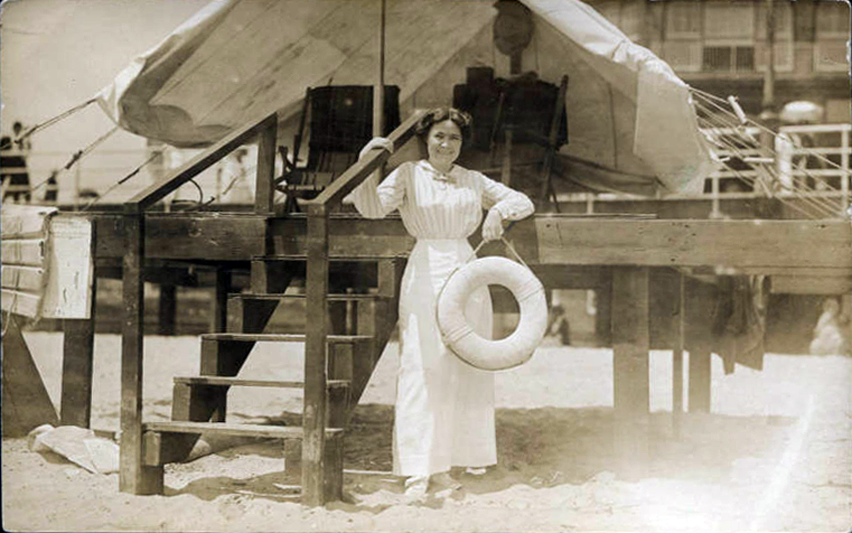 Atlantic City - Young woman with a life ring posed on the boardwalk steps - Harper B Smith