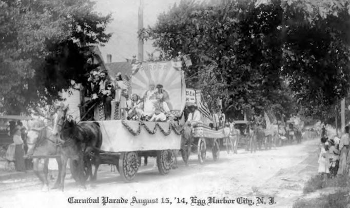 Egg Harbor City -  The Carnival Parade - This parade was a community-wide effort held in the early teen years of the 1900s - memebers of the Aurorora Singing Society are on the nearest float - August 15 1914 - EHC