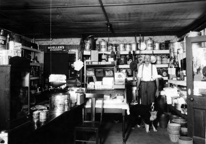 Egg Harbor City - Edmund Einsiedel and his dog in the Grocery and Pottery store that was located on the western corner of Agassiz Street and 3rd Terrace - c 1930s-1940 - EHC