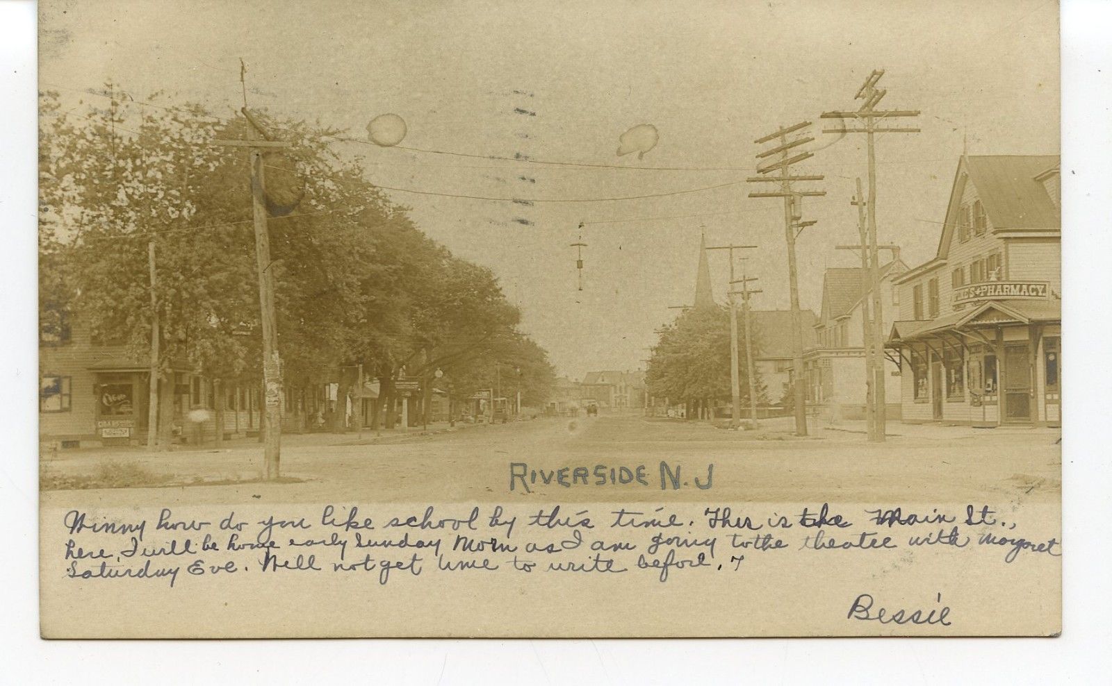 Riverside - Street view featuring a phamacy - 1906